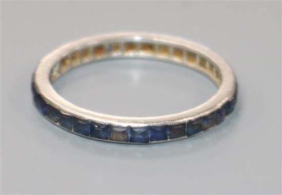 A platinum? and sapphire set full eternity ring, size O.